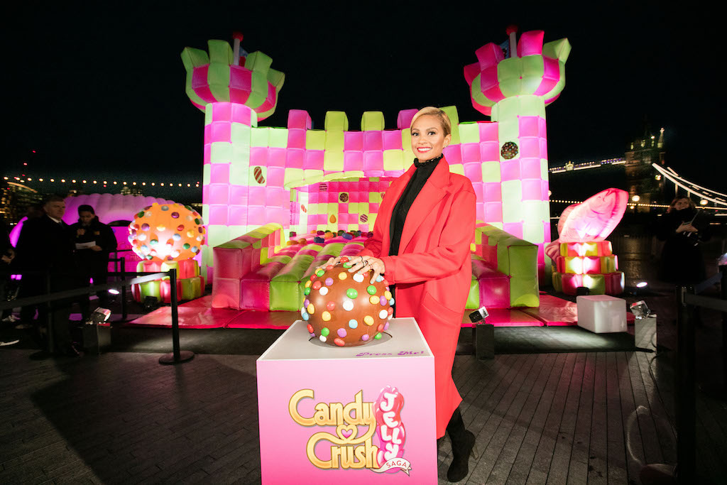 The jelly-themed, adults-only bouncy castle which has been created to celebrate the launch of Candy Crush Jelly Saga, opens on London’s Southbank. Picture date: Wednesday March 2, 2015. The multi-sensory bouncy castle especially designed for grown-ups, opens today to mark the latest instalment of the new mobile game, Candy Crush Jelly Saga. The bouncy castle brings to life elements of the jelly-themed game and will be open to the public for free. The castle, which appears to be made up of cubes of lime and raspberry jelly, will encompass a range of multi-sensory elements, emitting fragrant, raspberry jelly-scented clouds from within its walls and making noises from the game when jumpers bounce on certain candy squares. It will also replicate the game’s new competitive element and introduce visitors to Candy Crush Jelly Saga’s latest character, the Jelly Queen. Photo credit should read: Kois Miah / King Digital
